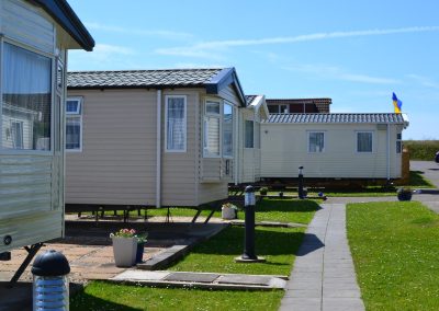 Row of mobile homes on sunny day